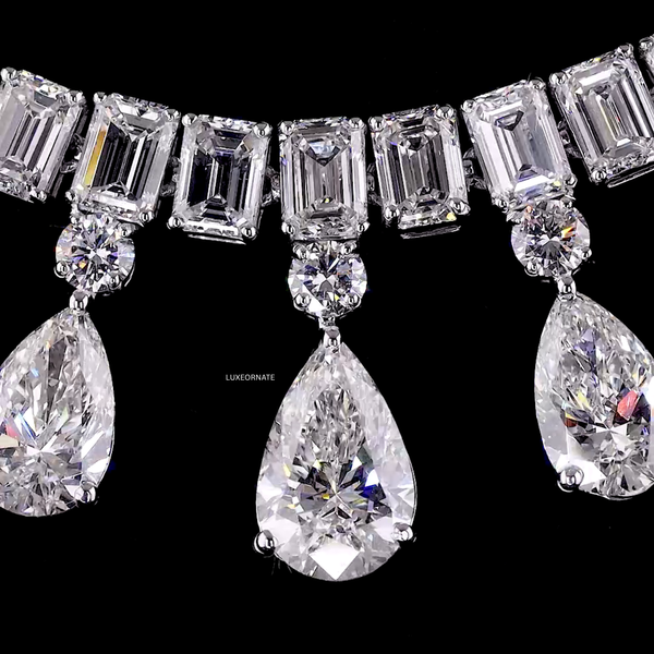 Luxury statement necklace with emerald cut and pear shape diamonds