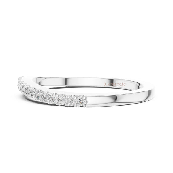 Luxury fine jewelry diamond band ring with polished white gold finish and subtle brilliance