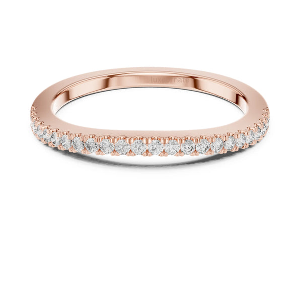 Delicate diamond band ring with round brilliant diamonds set on a thin rose gold band for minimalist luxury styling