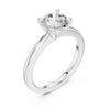 Timeless diamond engagement ring with four prong setting and polished gold band