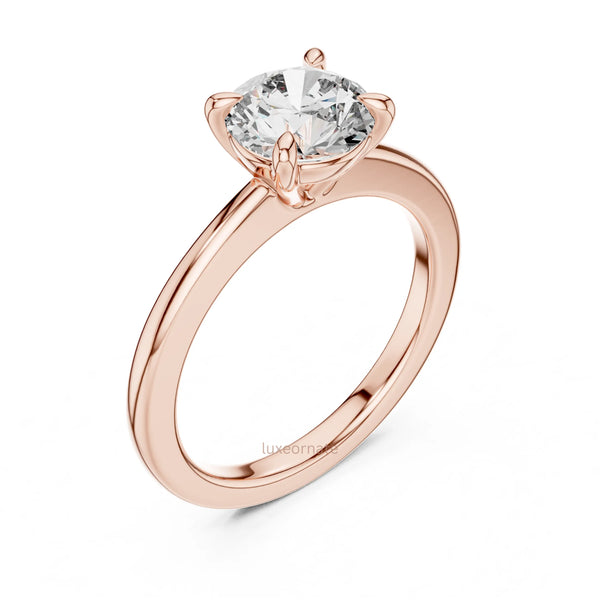 Refined round cut diamond ring with clean classic silhouette and comfort fit band