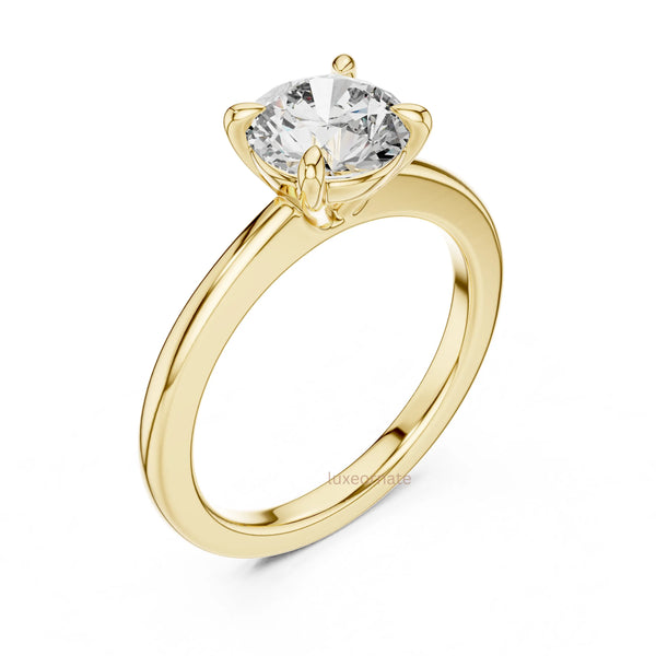 Classic round diamond solitaire ring crafted in polished gold for elegant everyday and engagement wear