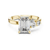 emerald cut diamond with one side two stone ring