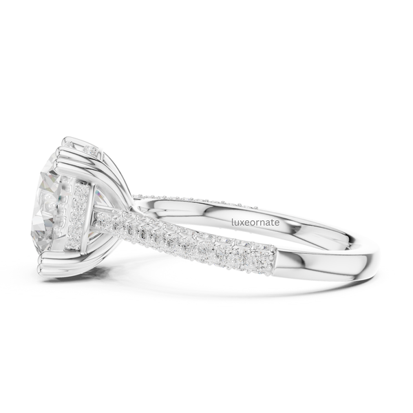 White gold round brilliant diamond ring side view with hidden halo and pavé split shank.