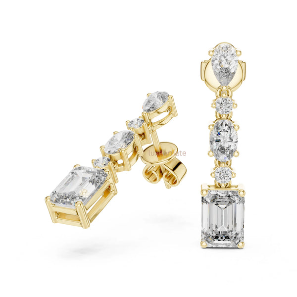 Elegant fancy shape diamond dangle earrings in yellow gold luxury jewelry