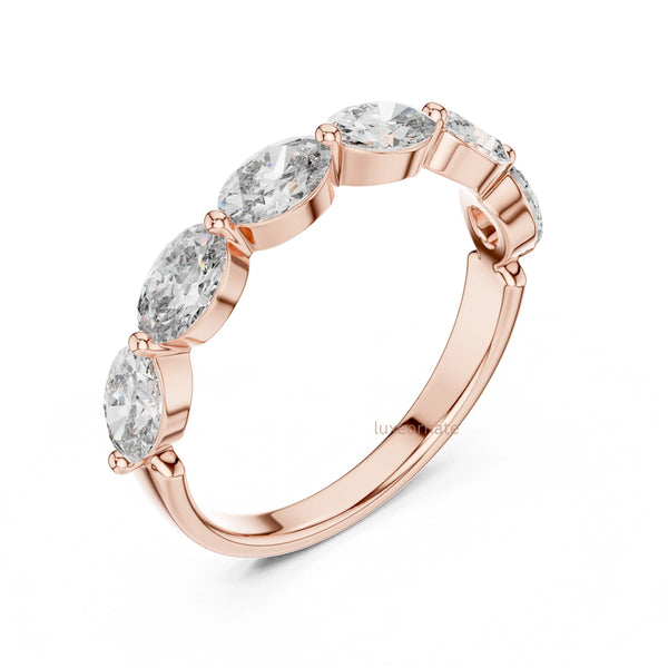 Rose gold oval cut diamond ring with prong set diamonds showcasing a timeless everyday luxury jewelry design