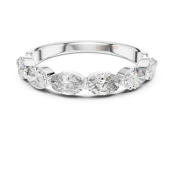 Close up view of oval diamond band ring in rose gold highlighting fine craftsmanship and sparkling diamonds ring