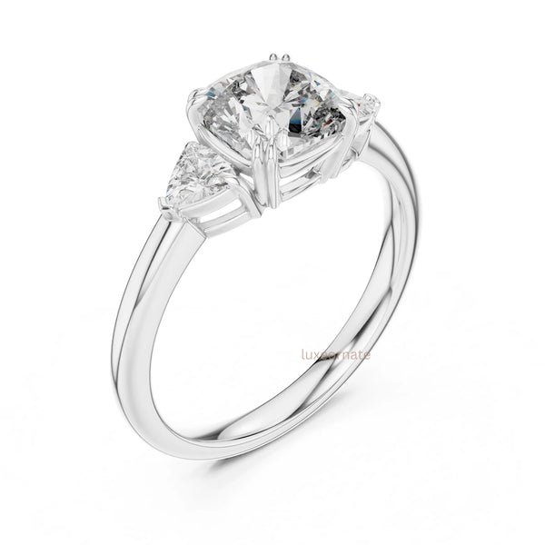 Close up view of oval diamond three stone ring showcasing fine craftsmanship and high polish gold band