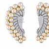 Close up golden pearl and pavΓ© diamond ear cuff earrings, high end designer jewelry