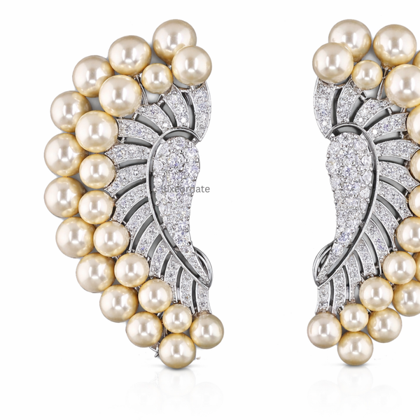 Close up golden pearl and pavΓ© diamond ear cuff earrings, high end designer jewelry