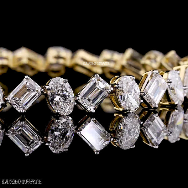 Oval and emerald cut diamond tennis bracelet in yellow gold by Luxeornate