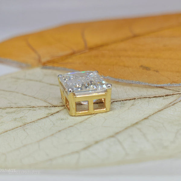 Emerald cut diamond pendant in yellow gold