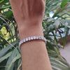 Emerald cut diamond tennis bracelet in 14k white gold