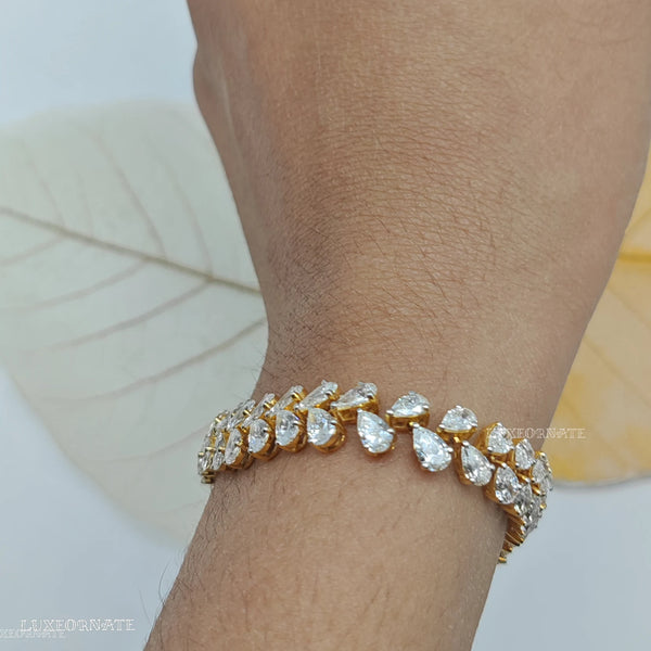 Pear cut diamond tennis bracelet in yellow gold for women, luxury bridal and anniversary jewelry