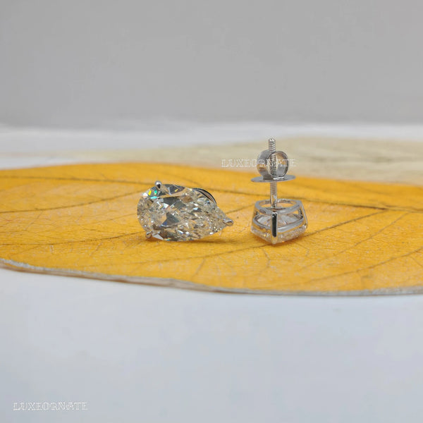 Pear cut solitaire diamond stud earrings in white gold, Teardrop earring, earrings for daily wear