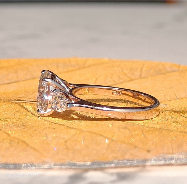 round cut three stone diamond engagement ring with pear side diamonds in white gold bridal jewelry, gifting jewelry.