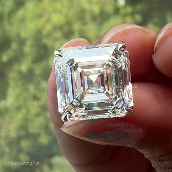 Asscher cut diamond solitaire stud earrings in square step cut design set in a classic four prong setting with elegant brilliance, gold earrings, luxury jewelry.