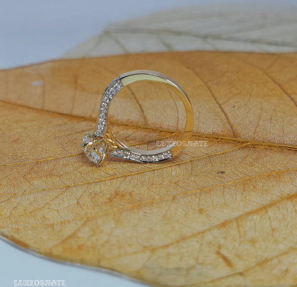 Round brilliant solitaire diamond ring with pave split shank