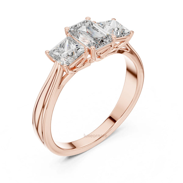 Emerald cut three stone diamond ring with princess cut side stones for wedding ring