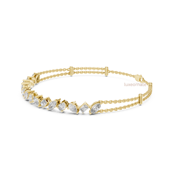 Luxury lab grown diamond bracelet with marquise, pear, emerald and oval stones in yellow gold