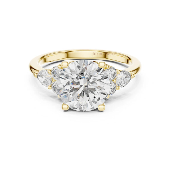 Eternal round lab diamond ring with three side stones in polished yellow gold