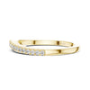 minimal diamond band ring with round cut diamonds in polished yellow gold