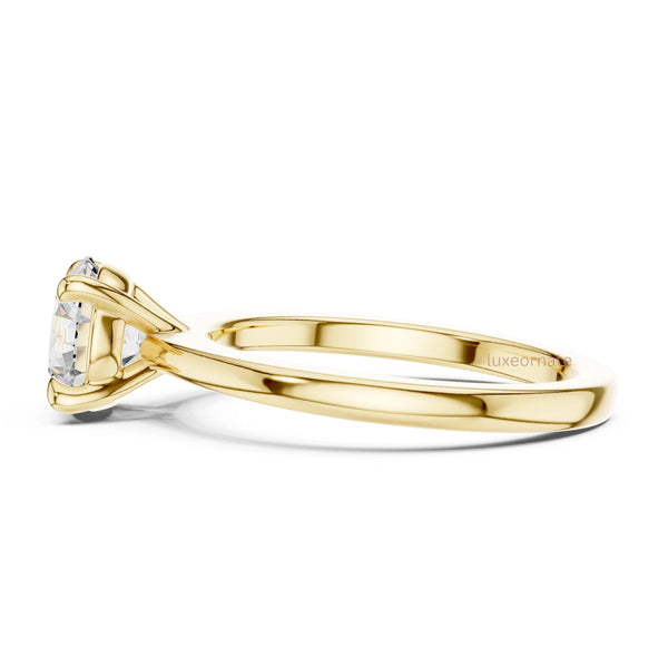 Elegant diamond ring with round cut center stone and smooth gold band showcasing timeless design