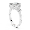 emerald cut diamond with one side two stone ring