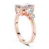 emerald cut diamond with one side two stone ring