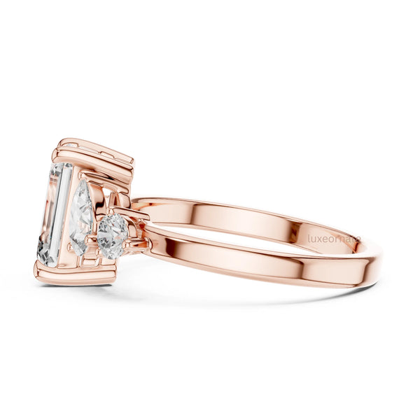 emerald cut diamond with one side two stone ring