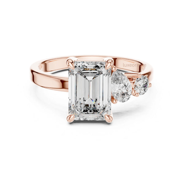 emerald cut diamond with one side two stone ring