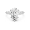 Pear shaped diamond engagement ring in white gold with split pavé shank and secure prong setting.