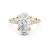 Pear cut diamond engagement ring in yellow gold with double pavé band and six prong setting, front view.