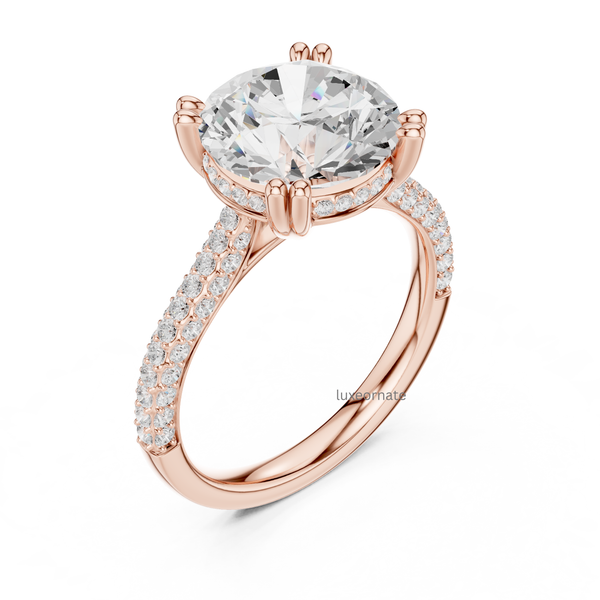 Rose gold round brilliant diamond engagement ring angled view with double pavé shank.