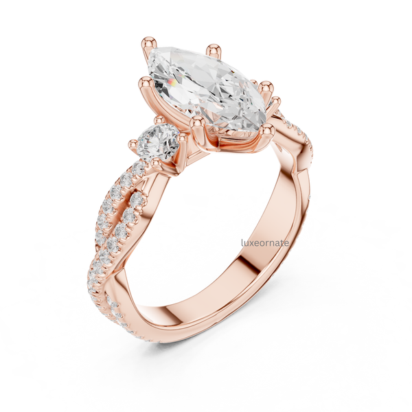 Angled rose gold marquise cut diamond ring with round side diamonds and twisted pavé shank.