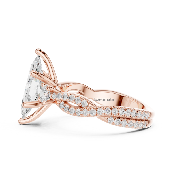 Side angle rose gold marquise diamond ring with round accent stones and pavé detailing.