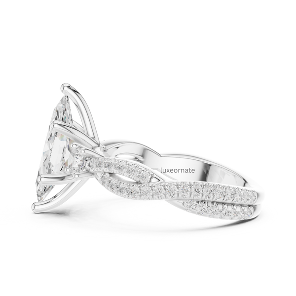 Side profile white gold marquise cut diamond engagement ring with pavé diamond band.