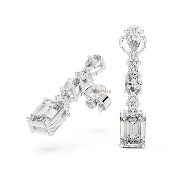 Designer diamond dangle earrings in gold for party wear