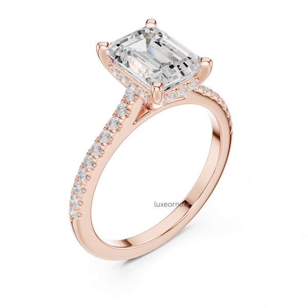 Angled view of rose gold emerald cut diamond ring showcasing elegant pavé diamonds