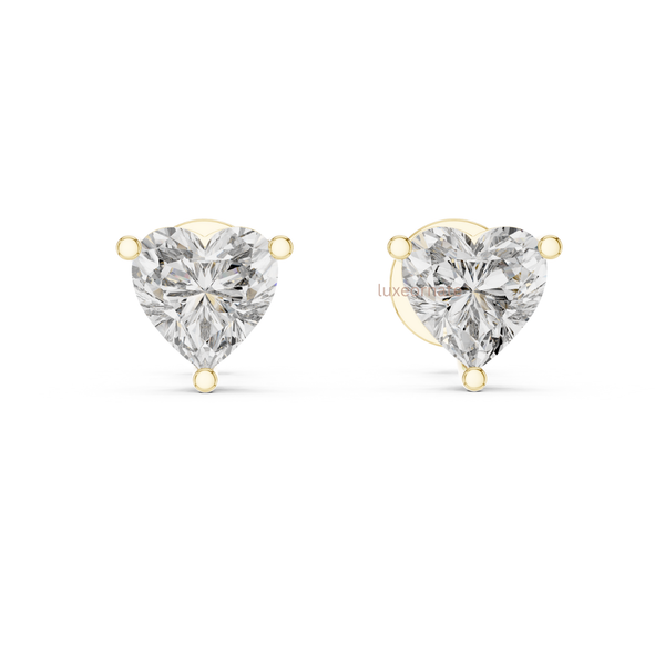 Heart cut lab grown diamond stud earrings in 14k yellow gold with secure three prong setting luxury fine jewelry
