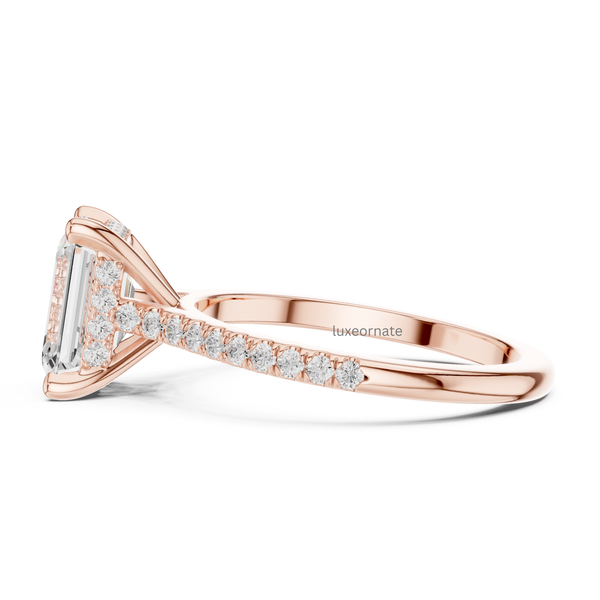 Side view of rose gold emerald cut diamond engagement ring with pavé detailing