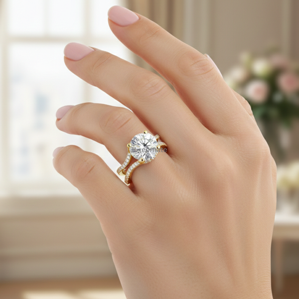 Model wearing yellow gold round cut diamond engagement ring with split shank pavé band.