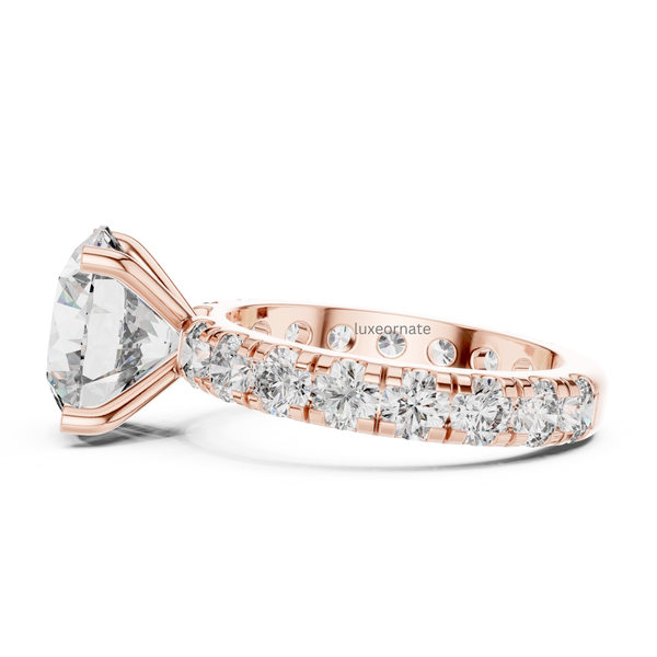 Side profile rose gold round brilliant solitaire engagement ring with pavé diamond band, lab grown diamond bridal ring, romantic luxury jewelry.