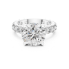 White gold round brilliant diamond engagement ring with pavé set band and four prong setting, lab grown diamond bridal ring, modern fine jewelry.