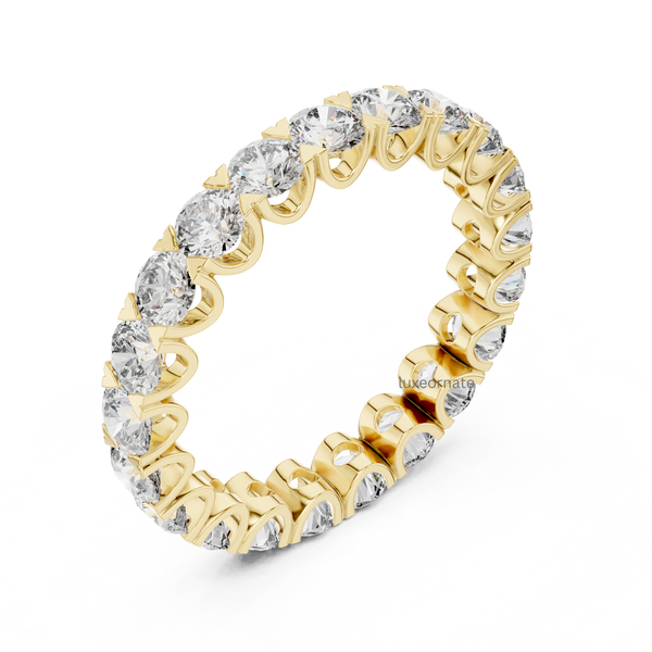 Angled 3D yellow gold round lab grown diamond eternity ring with open gallery shared prong setting, luxury wedding jewelry.