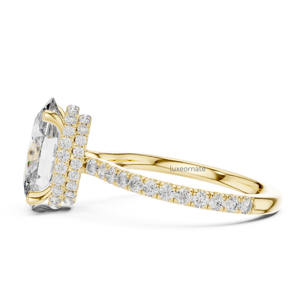 Side profile yellow gold oval halo ring with double row diamond halo and pavé band.