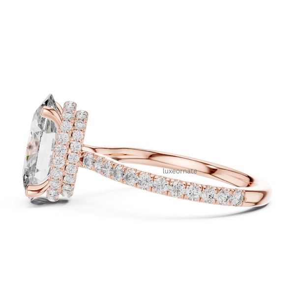 Side profile rose gold oval cut halo ring with pavé band and elevated gallery.