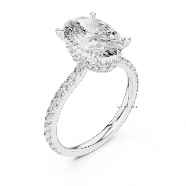 Angled side view white gold oval cut halo engagement ring with pavé diamonds.
