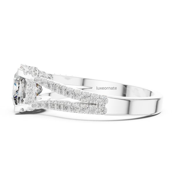 Side profile white gold cushion cut diamond engagement ring with cathedral style split band.